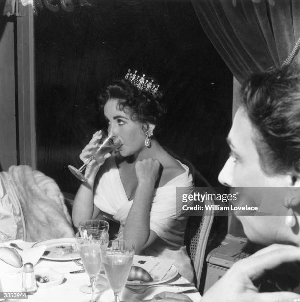 Actress Elizabeth Taylor dining at the Cannes Film Festival.