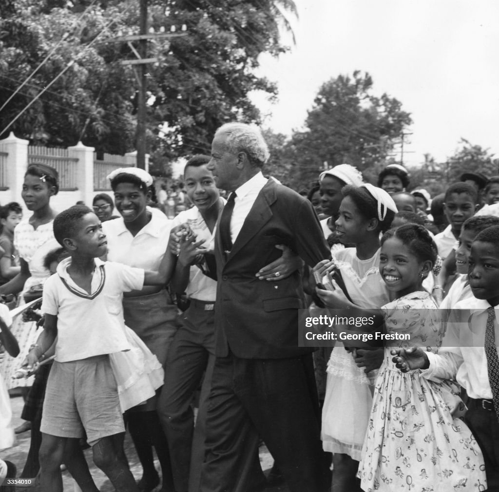 Jamaican Prime Minister Michael Manley Walking Through Spanish Town jamaican-prime-minister-michael-manley-walking-through-spanish-town