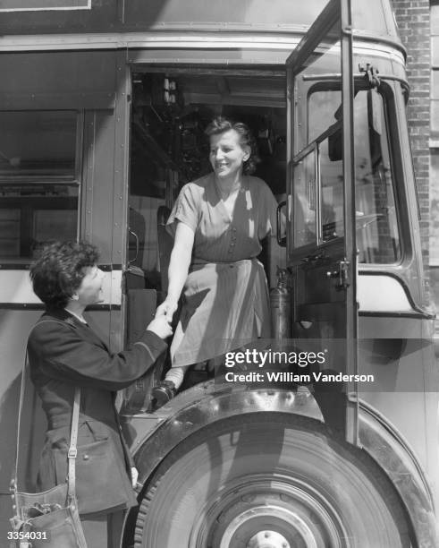 Russian bus driver Mrs Pelegeya Andreevna Fedina trying a Lodon trolleybus on a visit to the Hammersmith works.