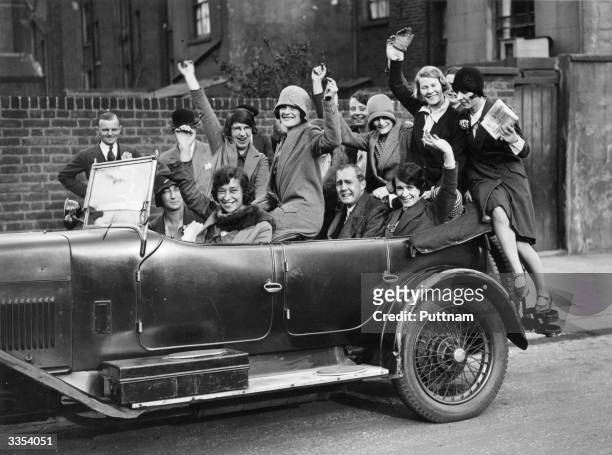 Captain Jan Fraser arriving at a polling station with a carload of flappers, to celebrate a Conservative Party election victory.