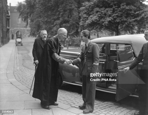 The Reverend Paul Fulcrand de Labilliere, Dean of Westminster, greets King Peter II of Yugoslavia outside Westminster Abbey, London.