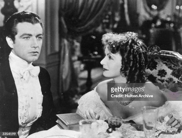 Robert Taylor and Greta Garbo play the doomed lovers in the film 'Camille', an MGM production directed by George Cukor.