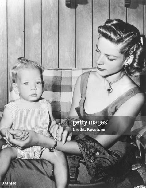 American actress Lauren Bacall, wife of Humphrey Bogart, with her son Stephen Humphrey at home in Laurel Canyon, California.