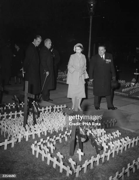 Queen Elizabeth II and the Duke of Edinburgh visit the 'Field of Remembrance' at Westminster, City of London.