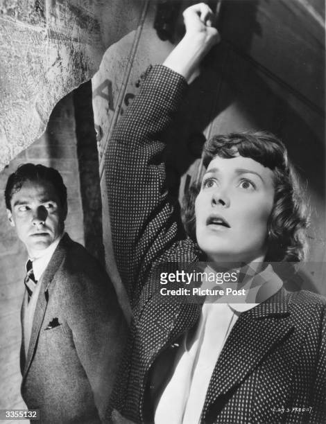 Actress Jane Wyman and Irish actor Richard Todd in a scene from the film 'Stage Fright', directed by Alfred Hitchcock. Original Publication: Picture...