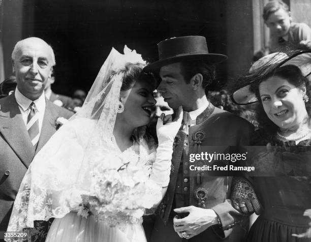 Austin Garcia, one of the stars of the Gay Spanish Gypsies of Carmen Amaya, with his bride Veronica Parmigiana who holds a coin as a symbol of luck,...