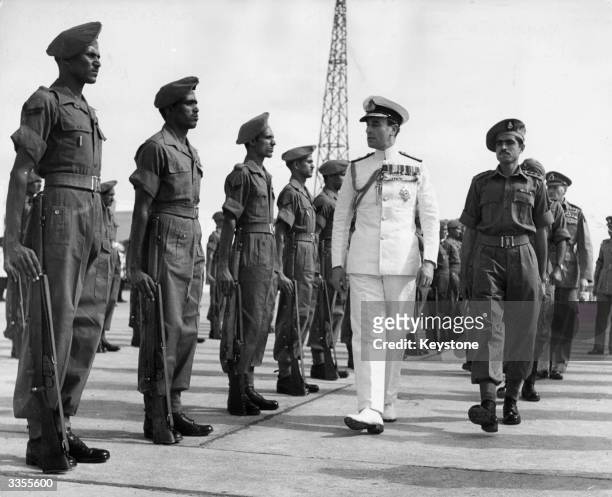 Lord Louis Mountbatten, 1st Earl Mountbatten of Burma , takes the salute from the Governor General's bodyguard at Viceroy House in New Delhi, as he...