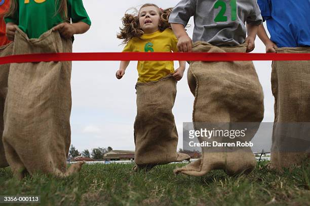 childrens sack race - sack race stock pictures, royalty-free photos & images
