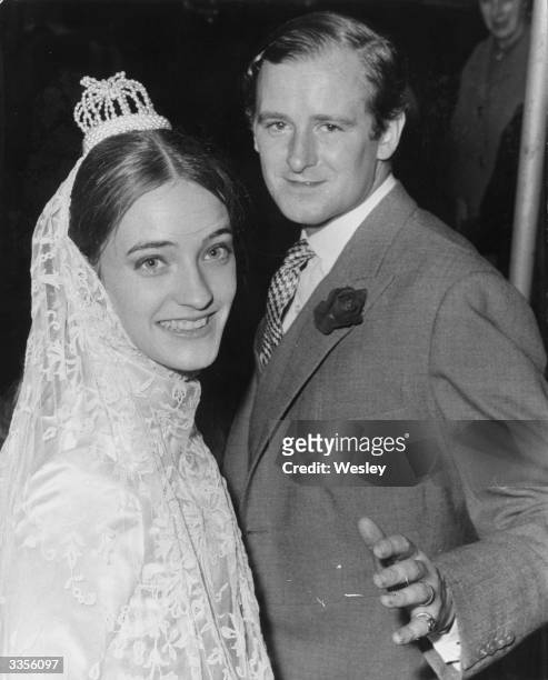 Desmond Fitzgerald, the 29th Knight of Glin, alongside his new French wife Louise de la Falaise, after their wedding in London.