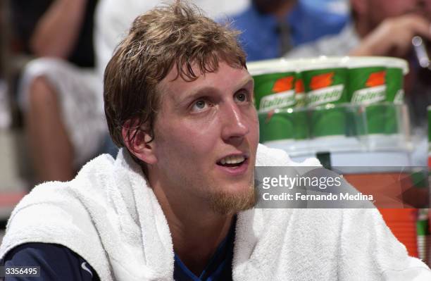 Dirk Nowitzki of the Dallas Mavericks sits on the bench during the game against the Orlando Magic at TD Waterhouse Centre on March 28, 2004 in...