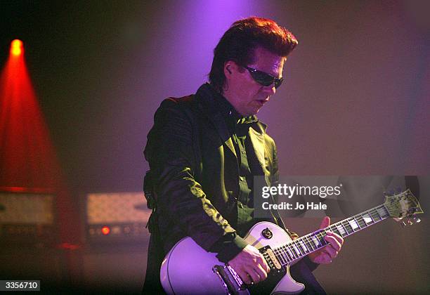 Andy Taylor of Duran Duran performs on stage during the first London date of their UK tour at Wembley Arena on April 13, 2004 in London. The original...