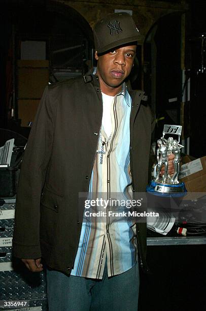 Rapper Jay Z poses backstage at the 2nd Annual TRL Awards at MTV Times Square Studios April 13, 2004 in New York City. The TRL Awards celebrate the...