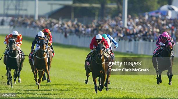 Jockey Larry Cassidy leads the field past the finishing post to win the Emirates AJC Australian Oaks held at Royal Randwick Racecourse, April 14,...