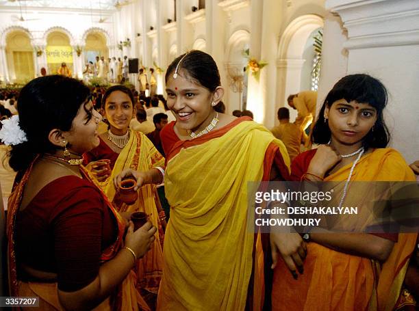 Young Bengali girls wearing traditional sarees celebrate the Bengali New Year at the historic palace of Sobhabazar in Calcutta 14 April 2004, On the...