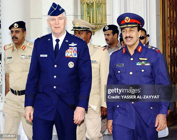 Gen. Richard Myers, chairman of the joint chiefs of staff walks with Kuwait's Chief of Staff Lieutenant General Fahd Ahmad al-Amir at Kuwait's...