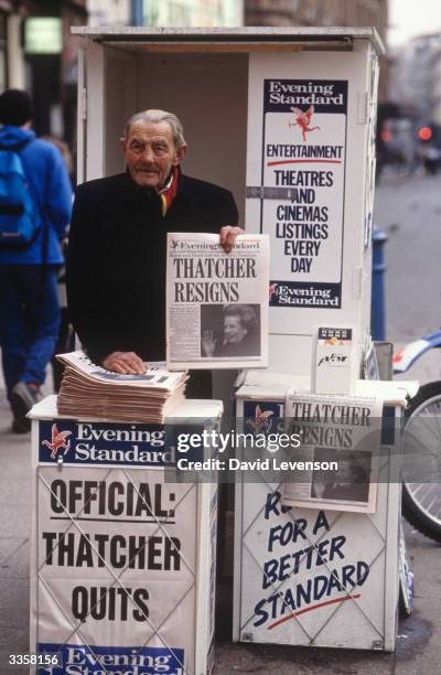 Newspaper vendor's stand in London, showing the headline of the London Evening Standard, announcing the resignation of Maragaret Thatcher as Prime...