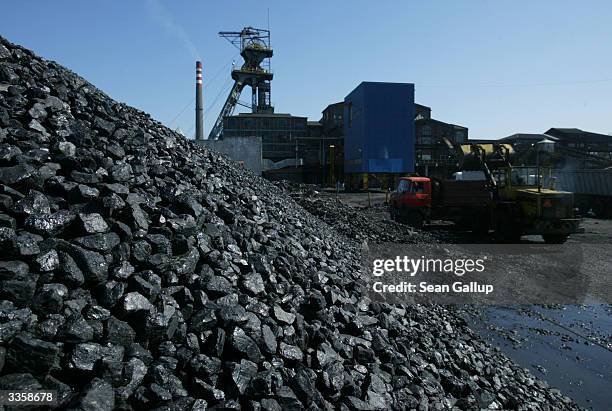 An earth mover loads a truck with freshly-mined, high quality coal at the Wieczorek coal mineApril 14, 2004 in Katowice, Poland. Poland will be the...