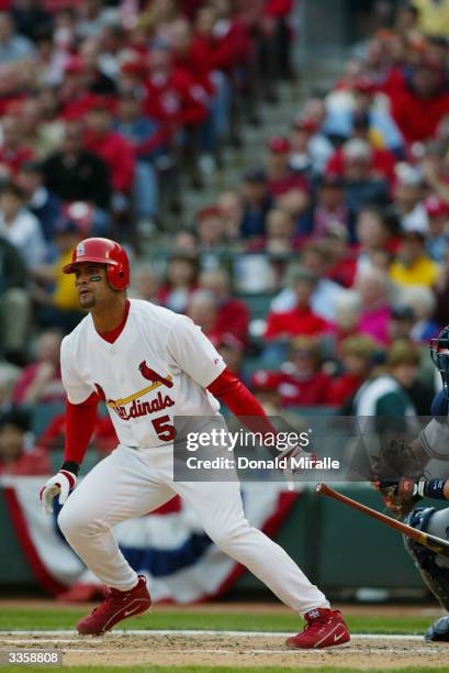 First baseman Albert Pujols of the St. Louis Cardinals swings during the game against the Milwaukee Brewers on Opening Day at Busch Stadium on April...