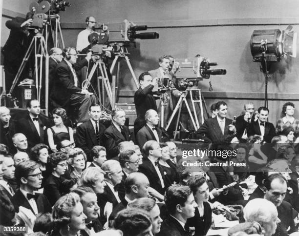 Television cameras in a crowded sale room at Sotheby's where seven impressionst paintings were sold for an unprecedented amount.