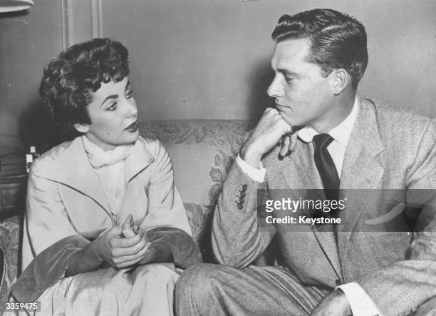 American film actress, Elizabeth Taylor with Nick Hilton meet to discuss a property settlement after their 205 day marriage. Hilton, the hotel chain...