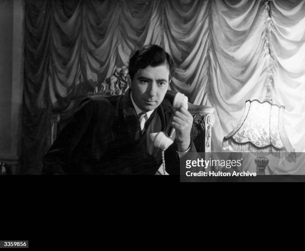 The English actor Robert Newton as Jim Mollison in a scene from the film about the aviator Amy Johnson entitled, 'They Flew Alone' directed by...