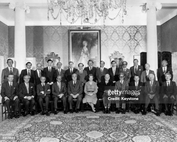 British Prime Minister Margaret Thatcher sits with her new Cabinet at No 10 Downing Street in London. Left to right : - Norman Fowler, Transport...