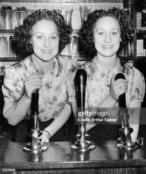 Twins Hilda and Doreen Turner, 19 year olds whose mother keeps a hotel near Boxhill.