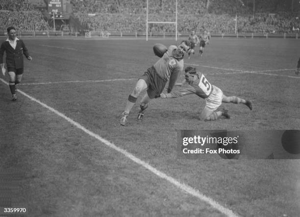 Warrington player fails to bring down his opponent during the Rugby League Cup Final between Leeds and Warrington, at Wembley Stadium, London.