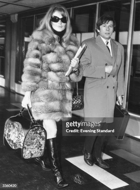 Polish filmmaker and actor Roman Polanski with his second wife-to-be Sharon Tate at London Airport.