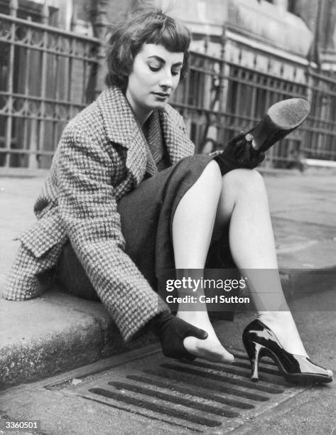 Dancer and model Jeann Marsh demonstrates how the new stiletto heel, which has just arrived in London from Paris, can be hazardous around town....