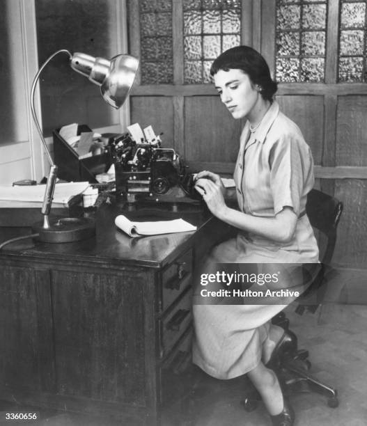 Typist at work in an office.