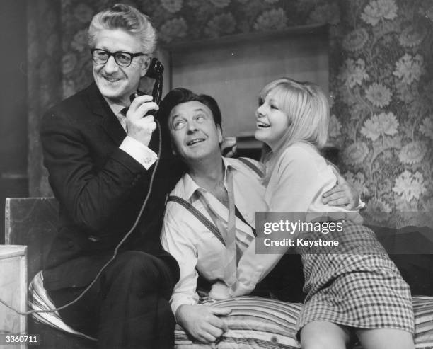 Jon Pertwee, Donald Sinden and Barbara Ferris rehearsing a scene from 'There's A Girl In My Soup' before it opens a British tour.