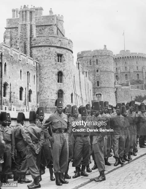 Soldiers of a contingent of the King's African Rifles during a visit to Windsor Castle, Berkshire.