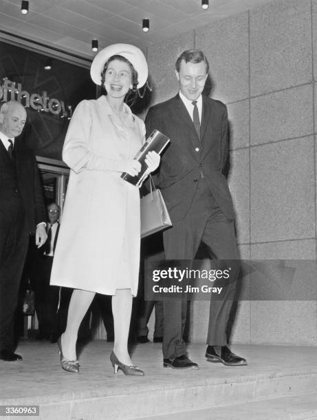 Queen Elizabeth II visits the Post Office Tower in London, with her is the Postmaster General Anthony Wedgwood Benn.