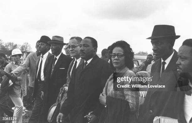 American civil rights leader Martin Luther King with his wife Coretta Scott King and colleagues during a civil rights march from Selma, Alabama, to...