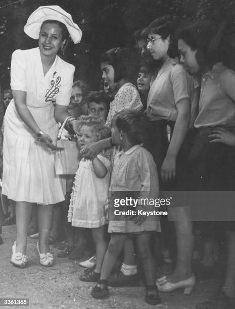 Evita Peron, wife of former Argentinian president and dictator Juan Peron, visiting a school in Sevres, Paris.