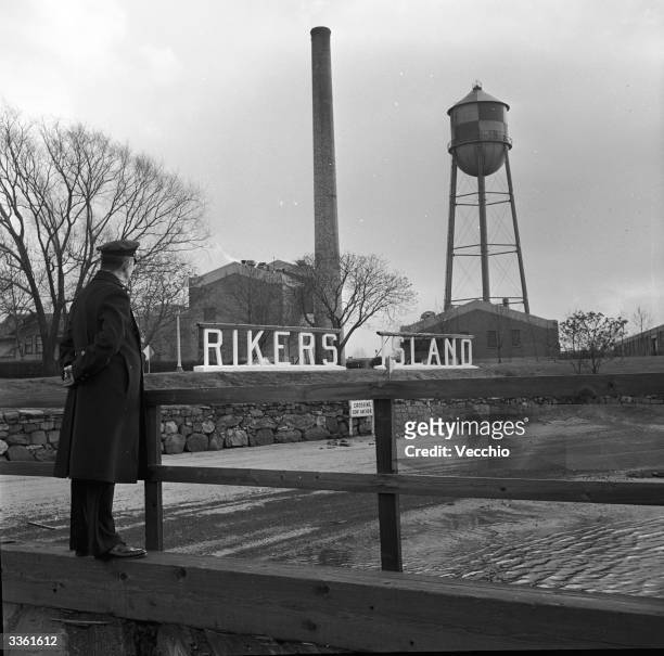 Guard at the entrance to Rikers Island penitentiary, New York.