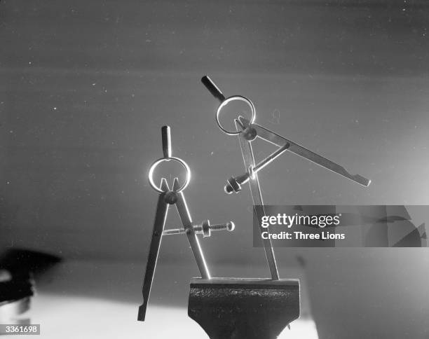 Two Compasses Pair Of Compasses Photos and Premium High Res Pictures - Getty Images
