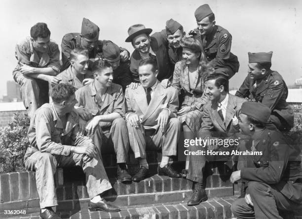 Bob Hope , British-born American comedian and film actor, with Frances Langford and American soldiers on the roof of 20 Grosvenor Square, London.