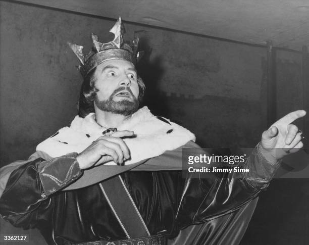 English actor Maurice Denham as King John during rehearsals for a production of King John directed by Peter Potter at the Old Vic Theatre, London.