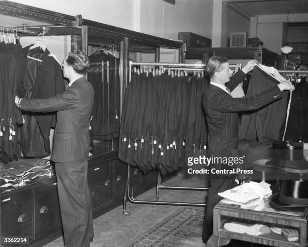 Staff at Moss Bros suit hire shop in London's Covent Garden prepare the suits for use at the forthcoming royal wedding of Princess Elizabeth and...