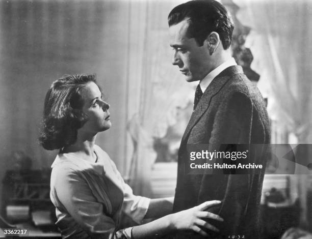 American actress Beatrice Pearson holds Mel Ferrer in a scene from the film 'Lost Boundaries'.