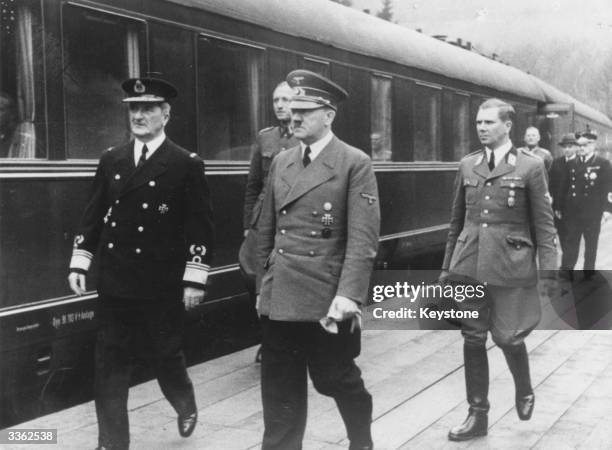 Adolf Hitler with Hungarian Admiral Horthy and Nazi Party Leader Martin Bormann . Hitler met the Hungarian High Quisling on his arrival in a special...