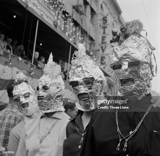 Among the less spectacular of the costumes at the New Orleans Mardi Gras are these home-made tin foil balaclavas.