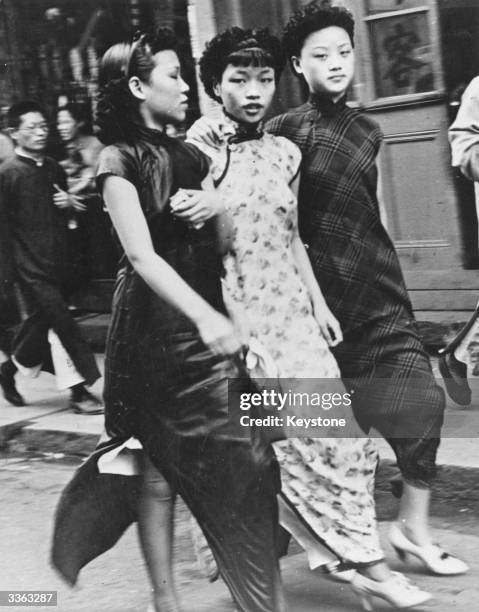 Chinese women in fashionable westernised Chinese dresses 'cheongsam'.