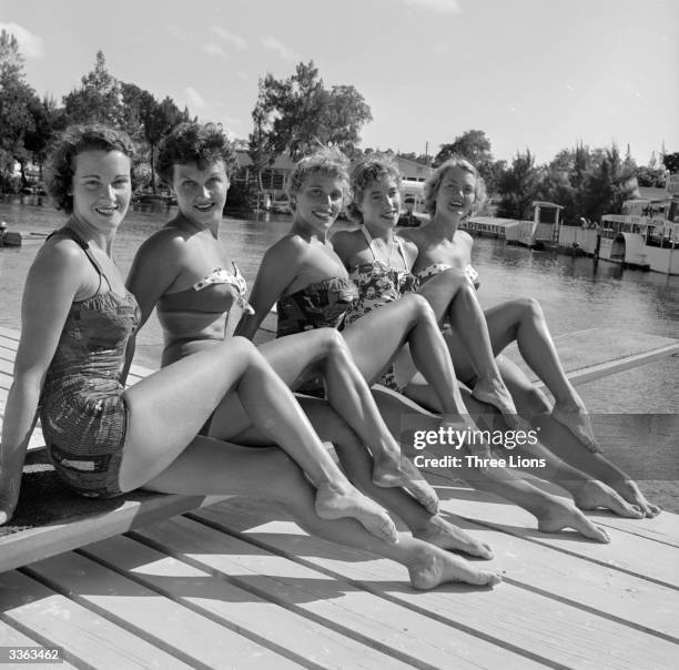The five Weekiwachee Mermaids of Florida pose above the aquatic stage where they perform their underwater 'aquaballet' act.