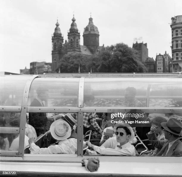 Boat trip through the canals in Amsterdam for the singing club from Essen in Germany. At first the Dutch resented the influx of German tourists,...