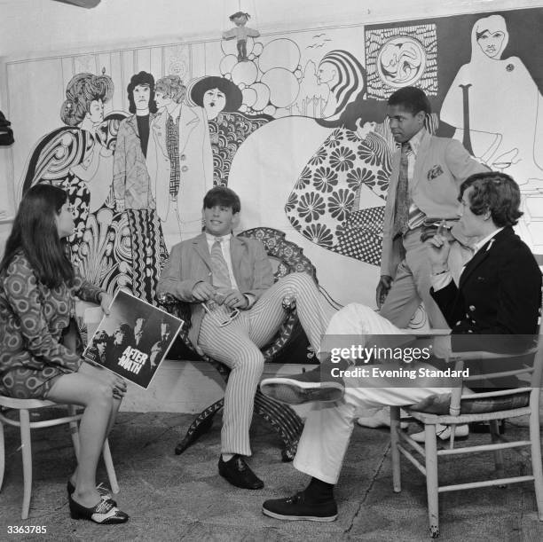 Fab fellers and groovy chicks hang out together at 'Hung On You' boutique in Chelsea's Cale Street, London. No shopping experience would be complete...