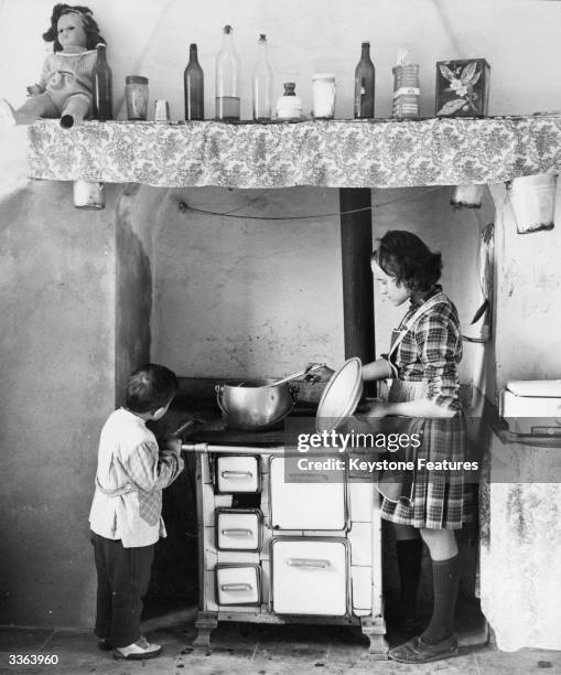 Year-old Maria Gatto does the cooking and housework for her father and six siblings, since the death of their mother. The family live in Noale, in...