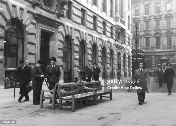 City businessmen stop for a chat on their way to work in the centre of London. Original Publication: Picture Post - 8061 - Bow Bells - unpub.